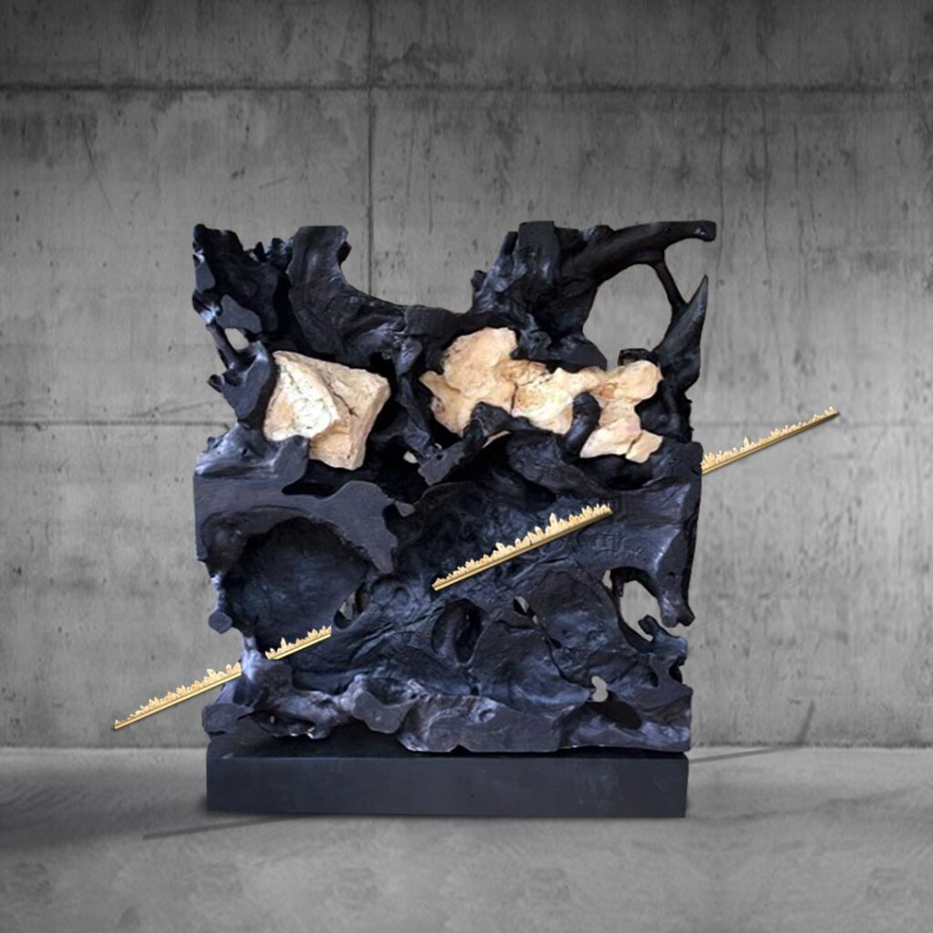 Abstract black and beige sculpture by Sunny Jackson with gold accents.